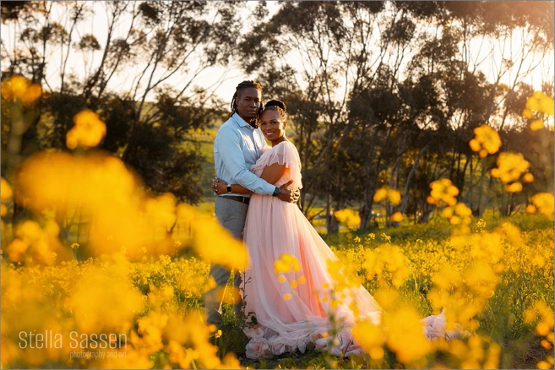 Engagement photo of couple in the canola fields